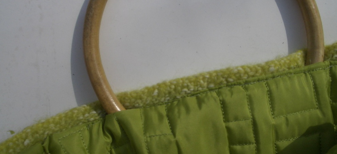 a close up of an oval object in a green fabric