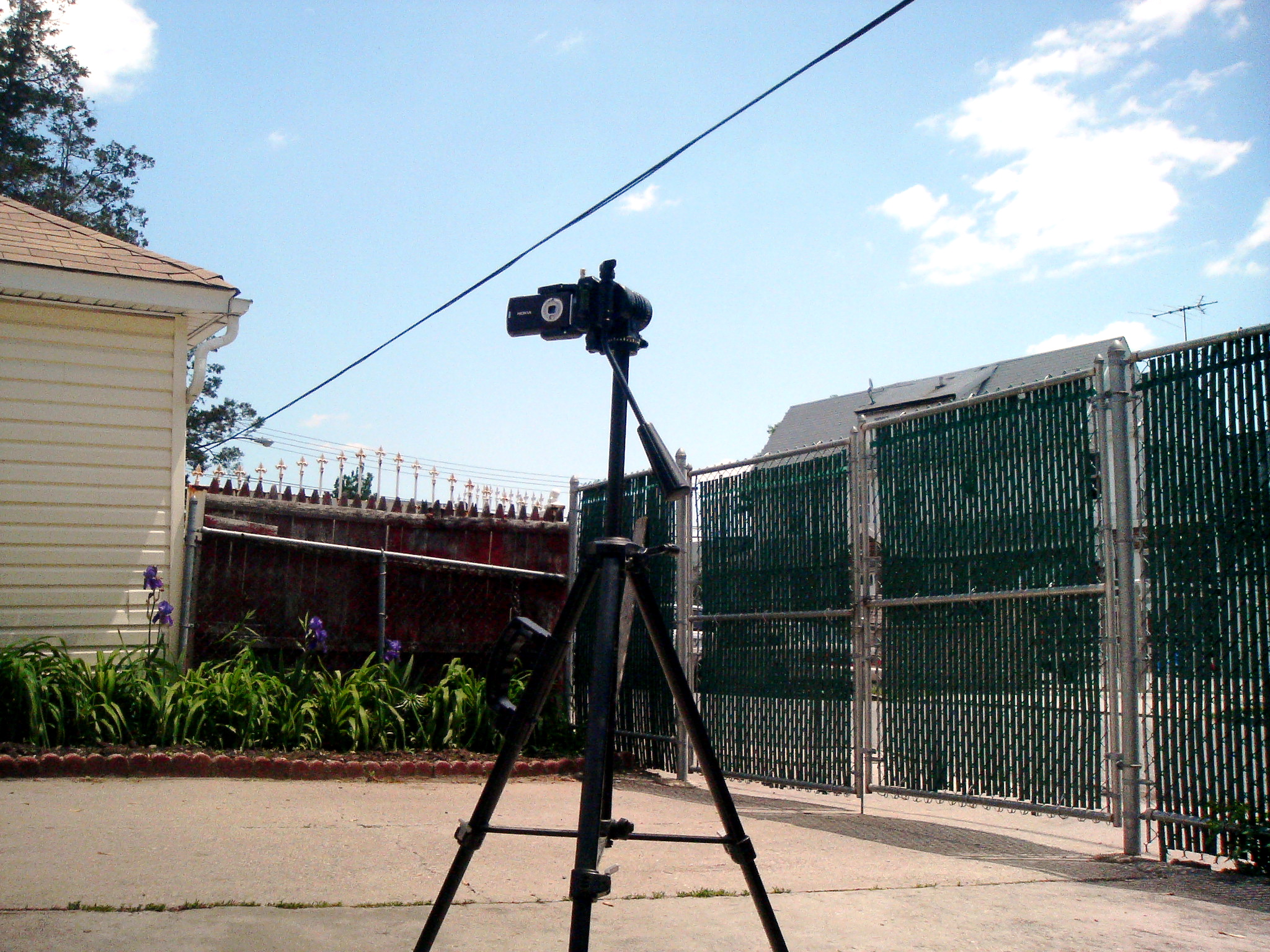 the small camera is sitting on top of a tripod