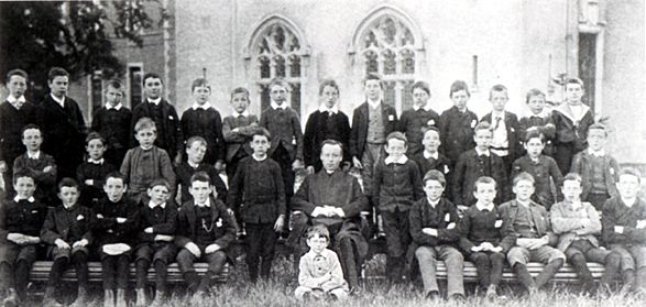 a large group of school students pose for a po