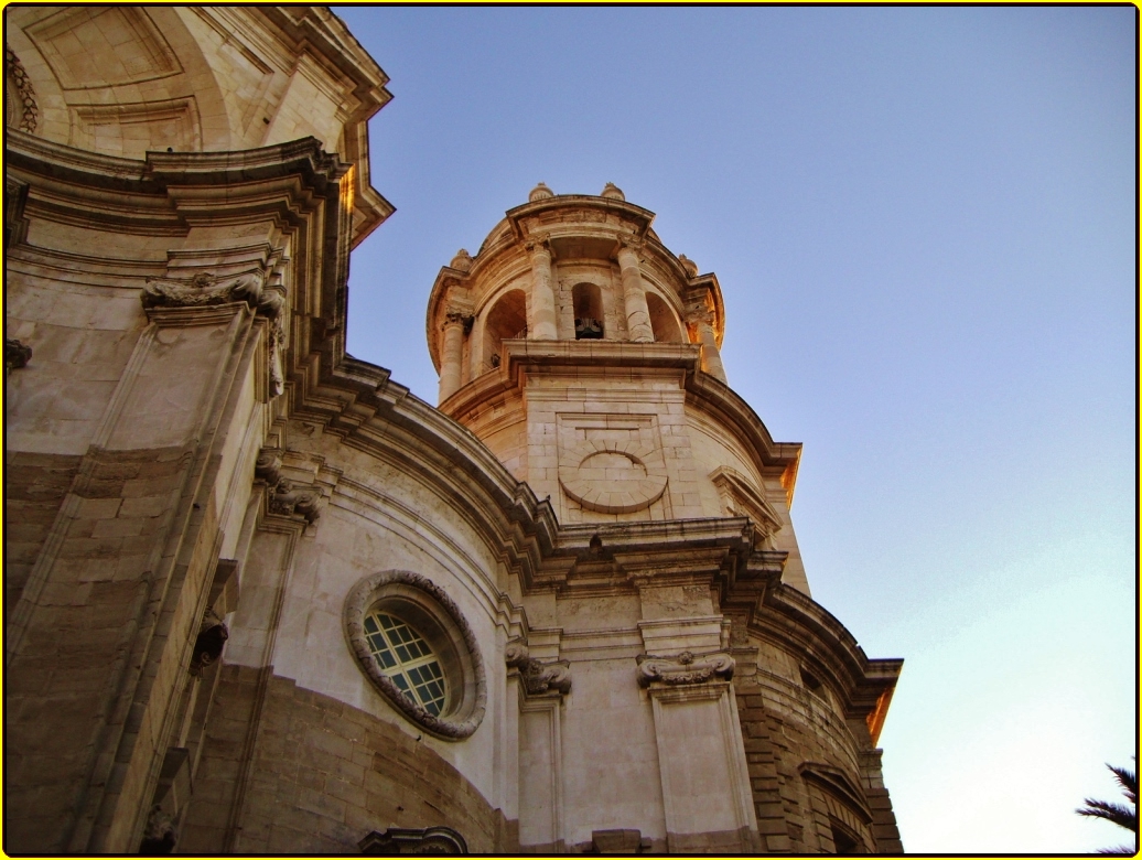 the tower and bell is the focal point in this pograph