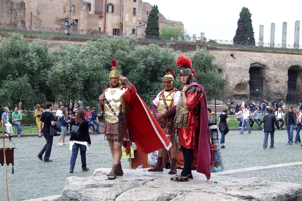 two men are dressed up in roman attire