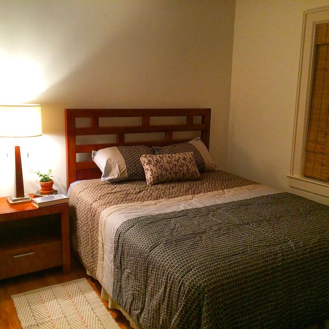 the bedroom has wood furniture in it and is light brown