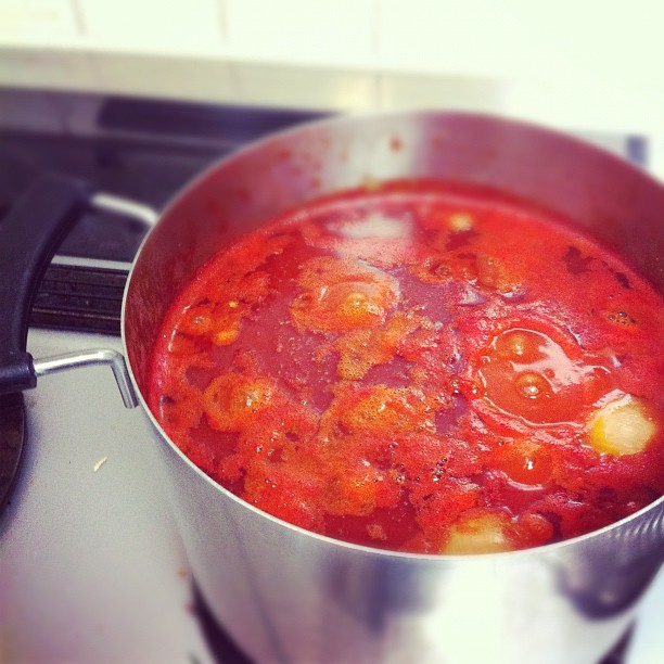 tomato sauce sitting in a pan on the stove