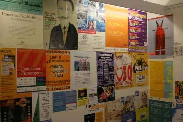 a wall of various kinds of political posters