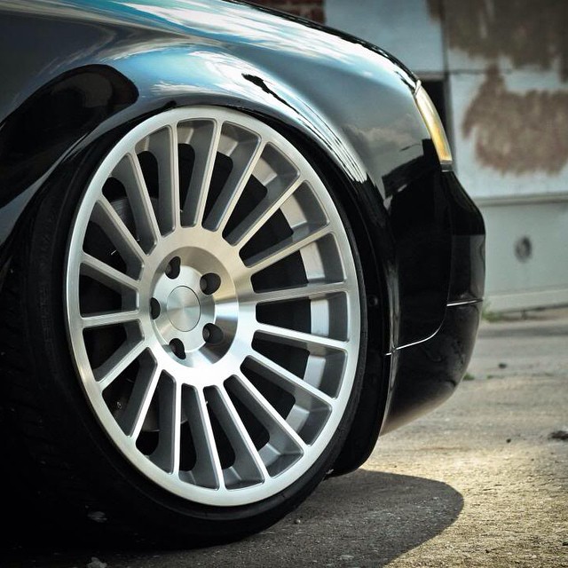 the front wheel of an elegant car in grey
