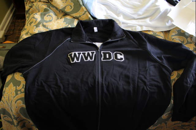 black jacket with wwu do on it on a coach