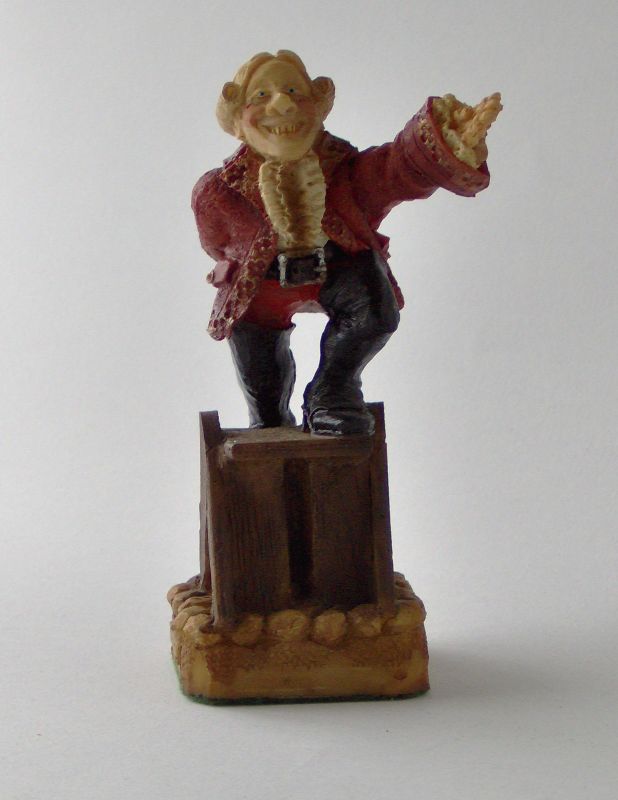 a miniature statue of a man holding his fist