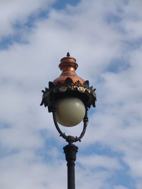 a light post with the sky behind it