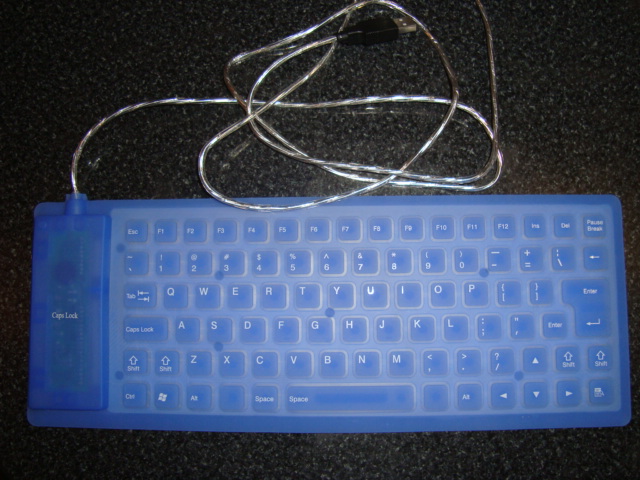 a plastic key board with a cord attached to it