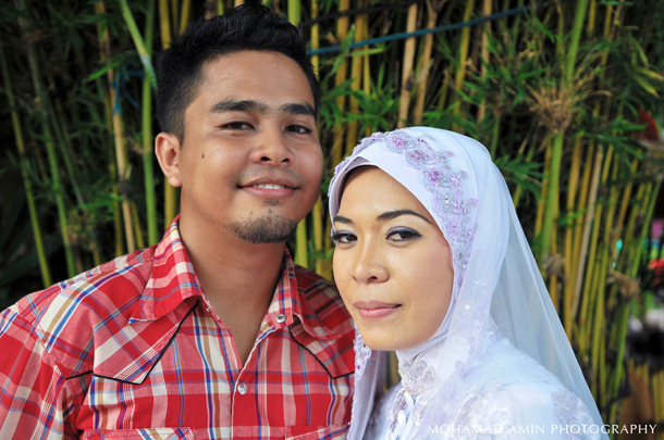 there is a young man and woman posing for the camera