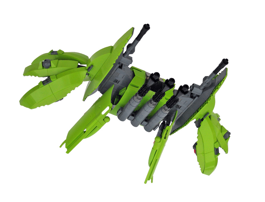a green lego jet is flying through the air