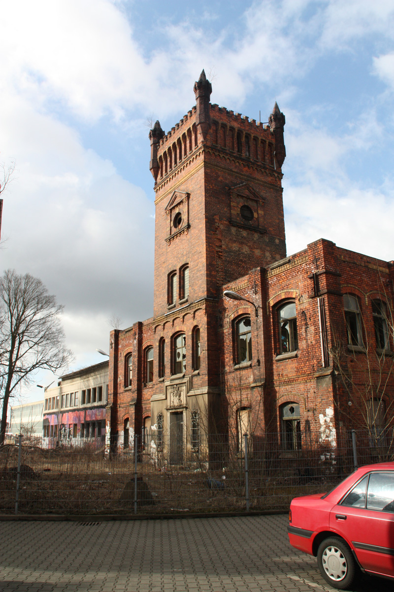 a very large building with a clock on the front