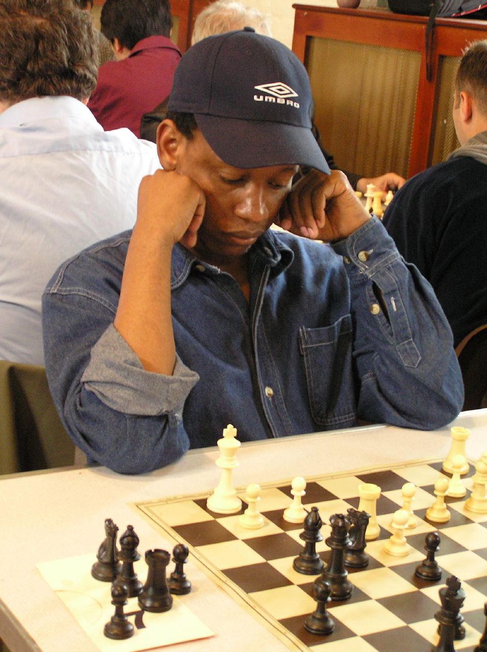 a man plays chess in a restaurant