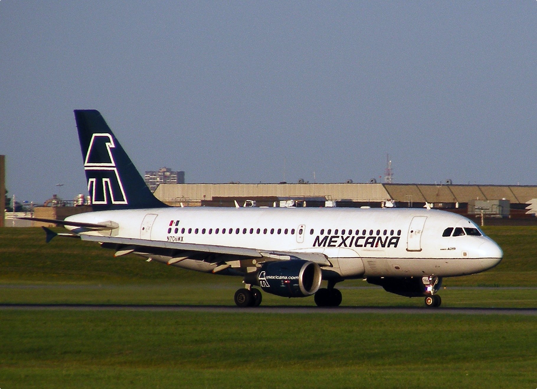 a commercial plane on the runway waiting for takeoff