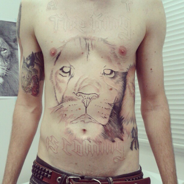 a man with a cat face on his chest