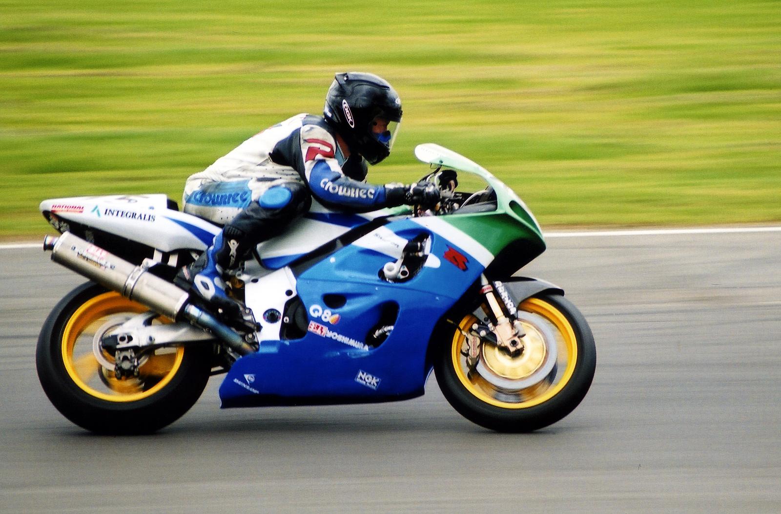 a man riding a motorcycle on a race track