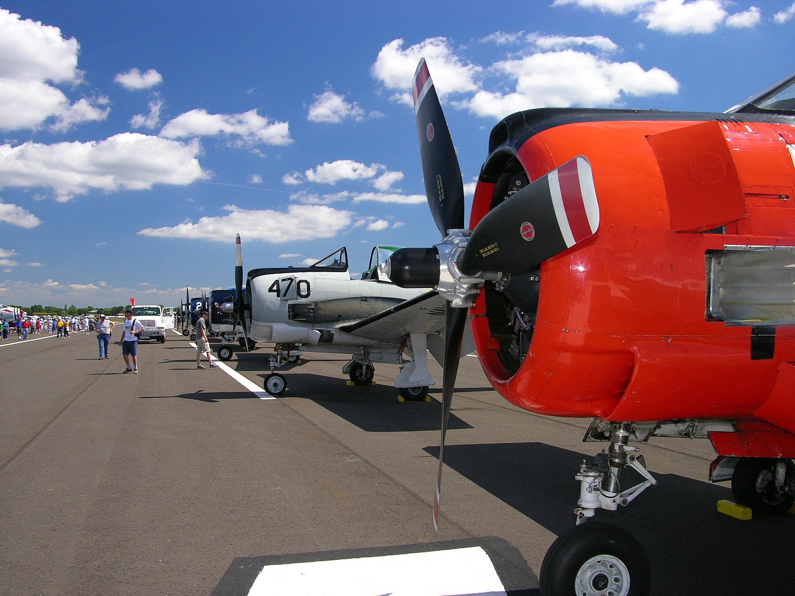 there are many small aircraft on the ground