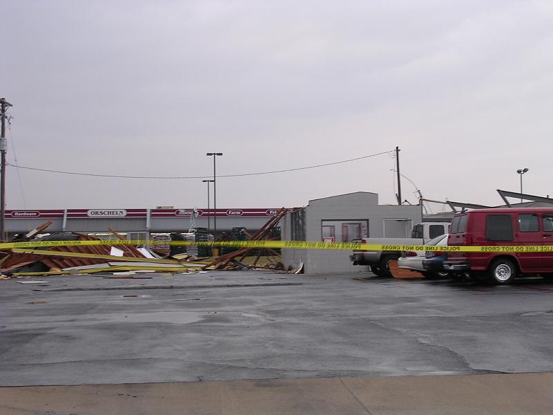 a parking lot with yellow tape across it