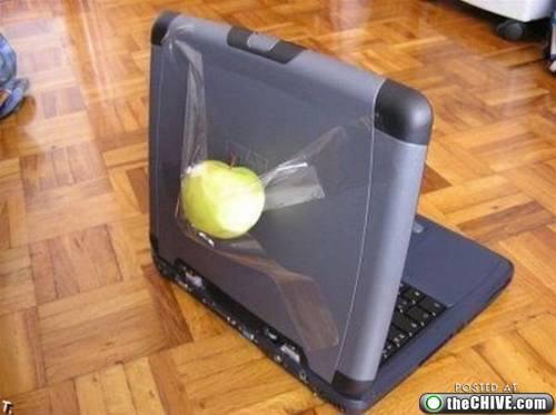 a laptop that has an apple on the keyboard