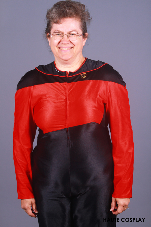 this is a very older woman wearing a red and black costume