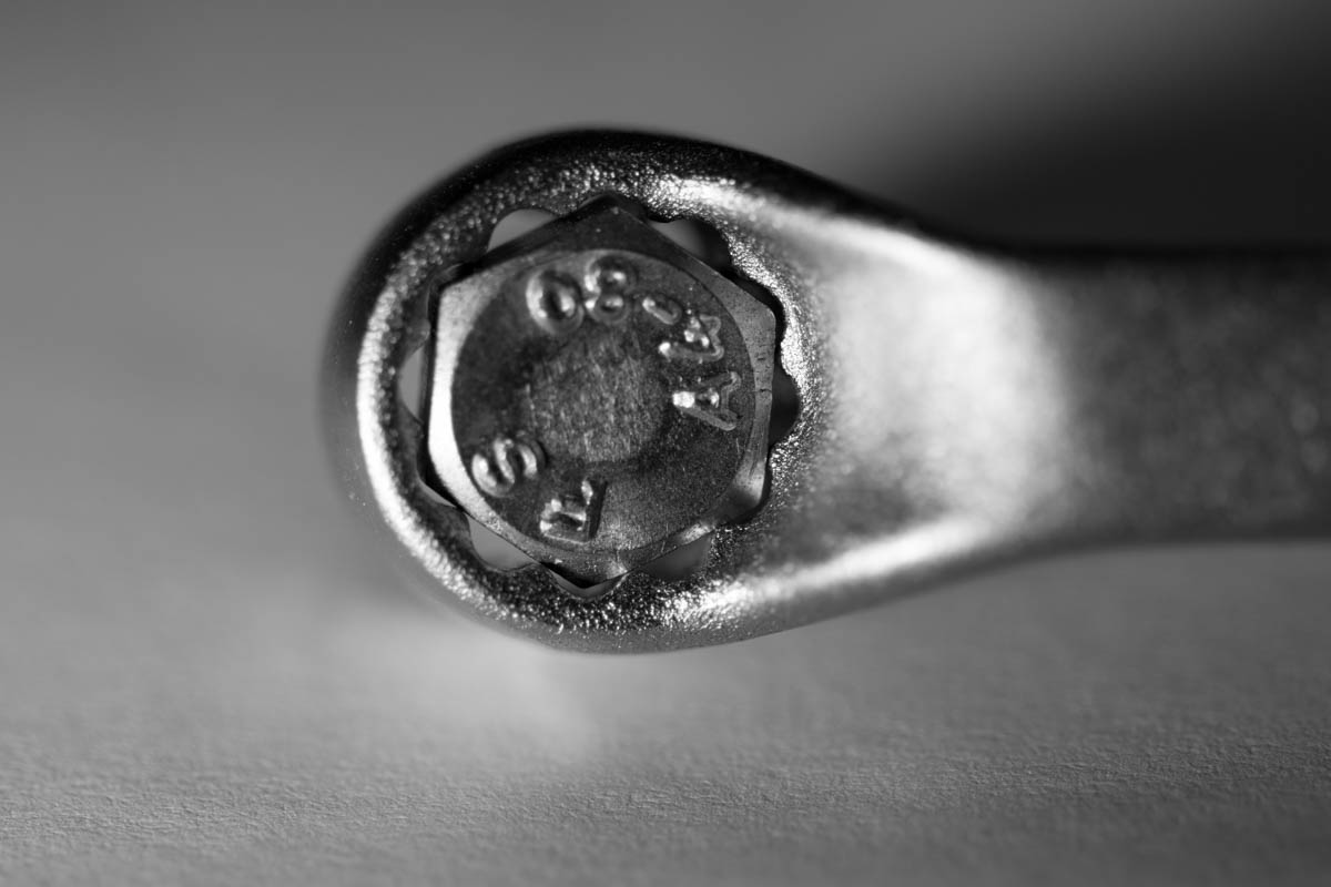 a small black and white stamp with a round face