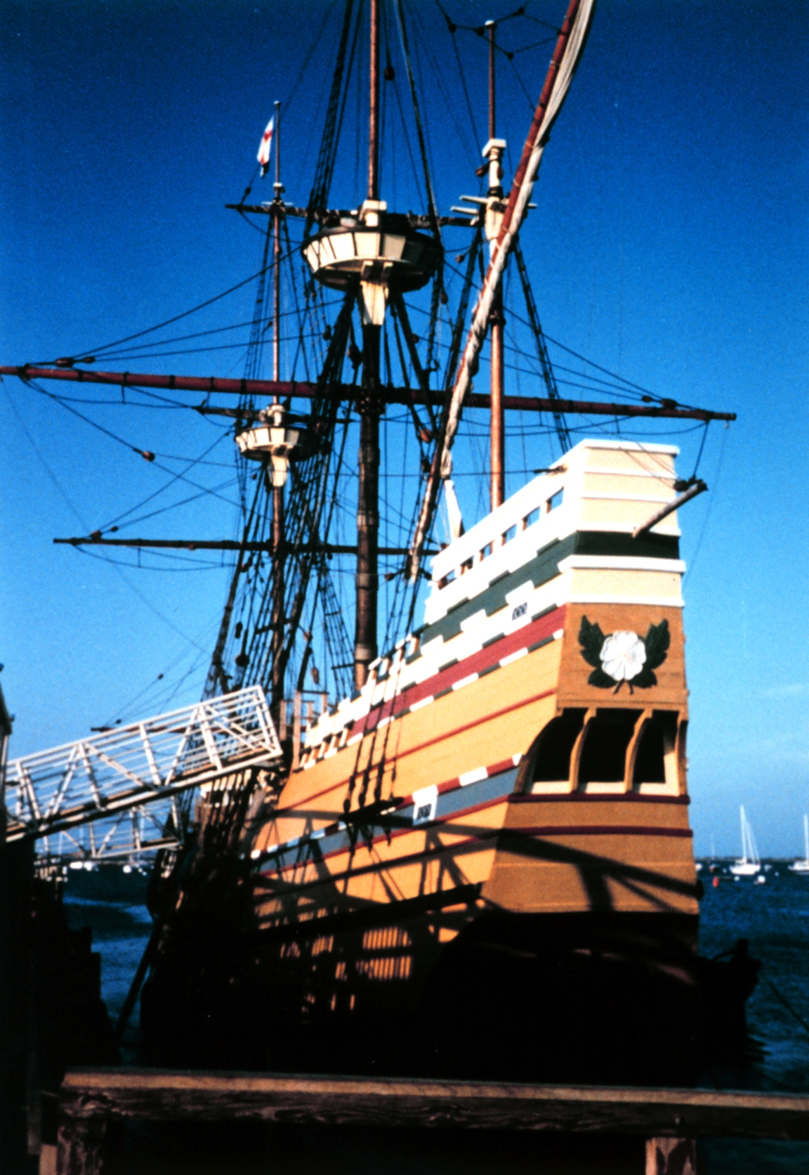 a pirate ship with large sails and two masts