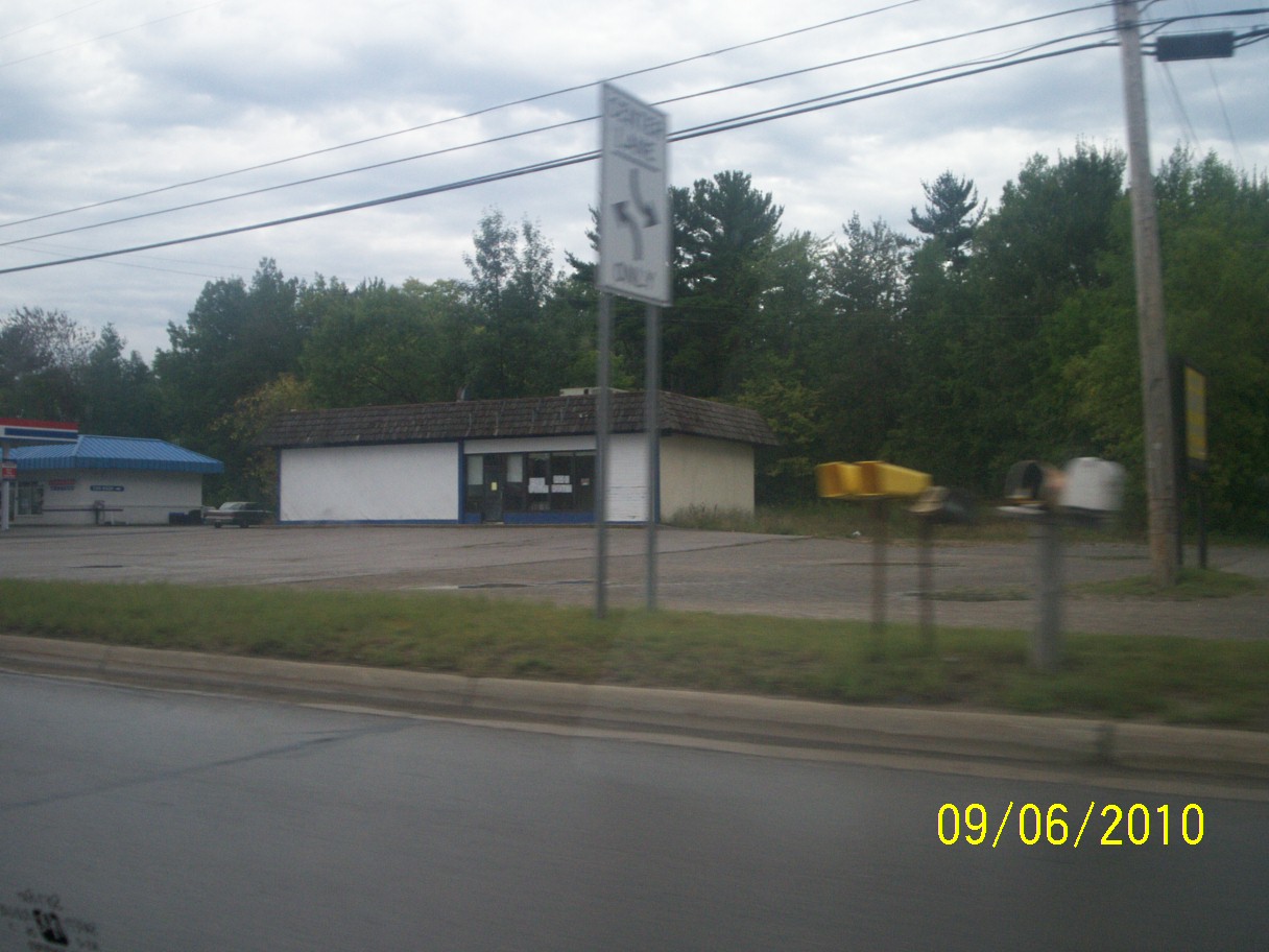 a large building that is sitting next to the side of a road