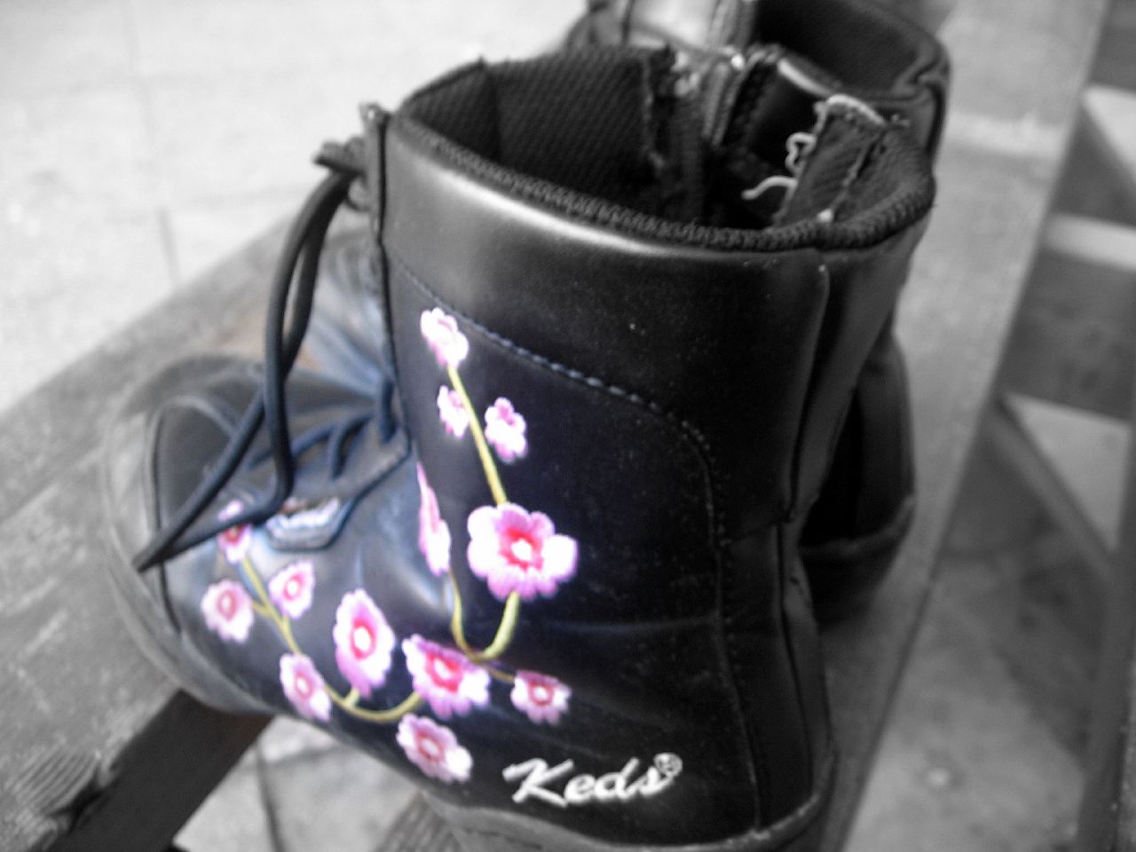 the boot is decorated with flowers on the inside