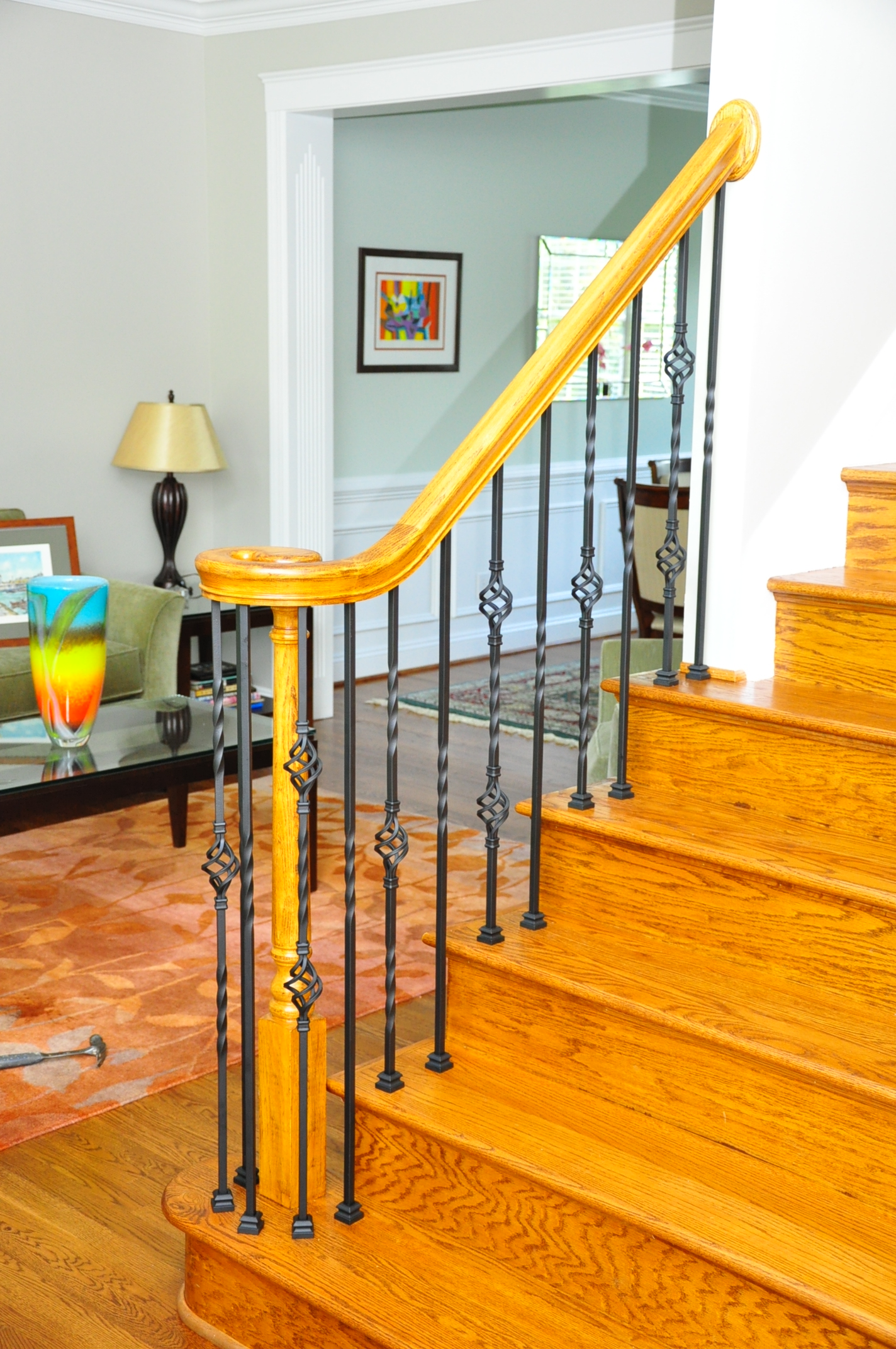 a living room with stairs and a couch