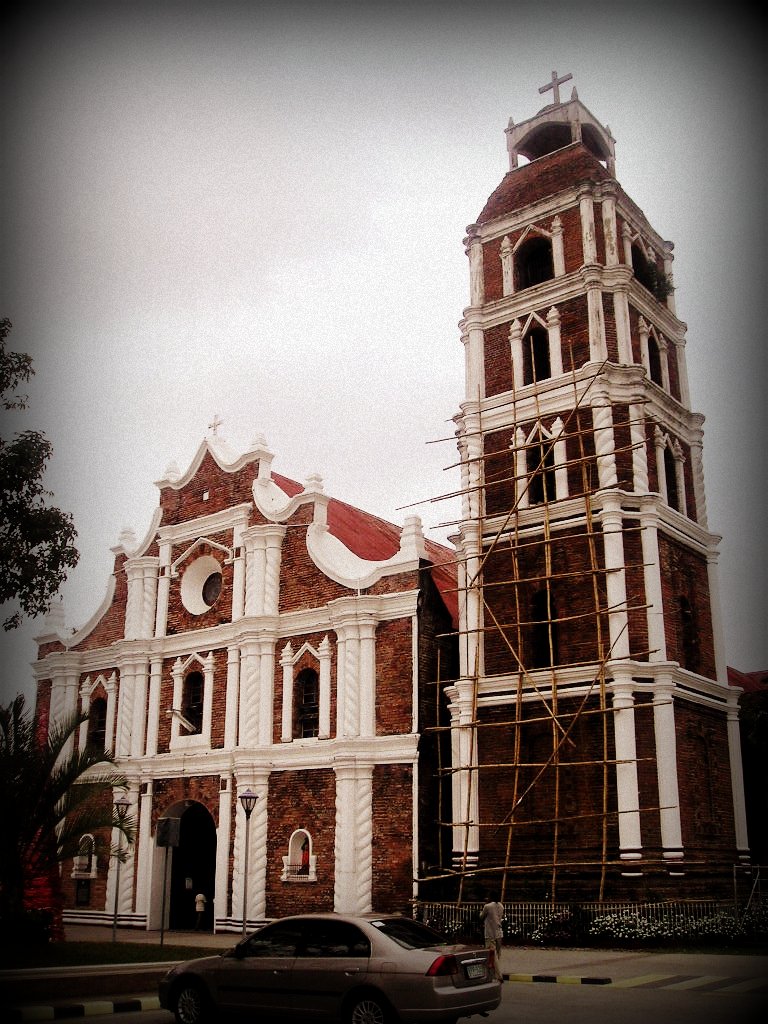 a church in the daytime with scaffolding around it