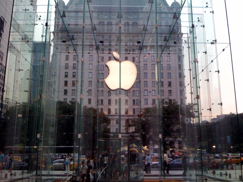 glass enclosed walkway next to apple building in new york