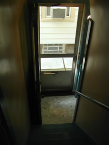 a door opened to a very narrow hallway