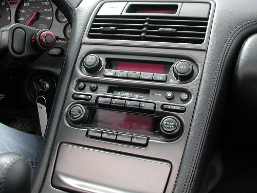 a close up of a car dashboard with the radio installed
