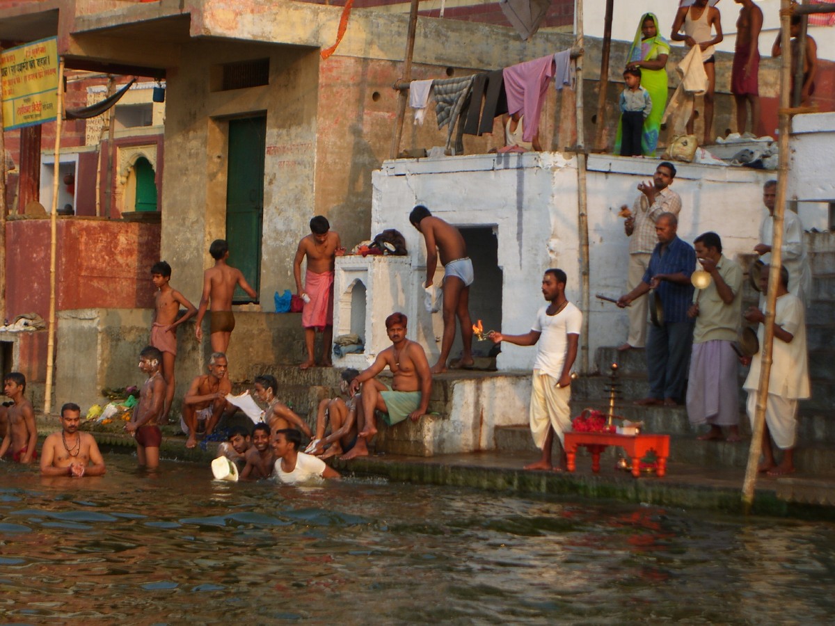 several people are watching others in the water