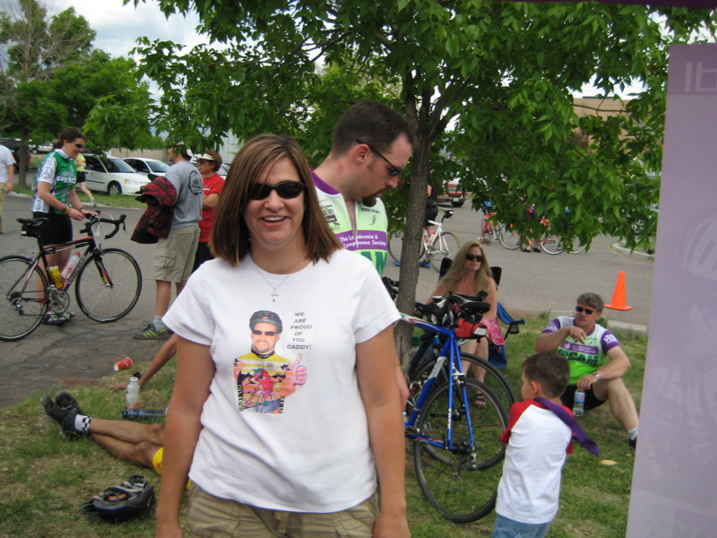 a woman standing in the middle of a park with her mouth open