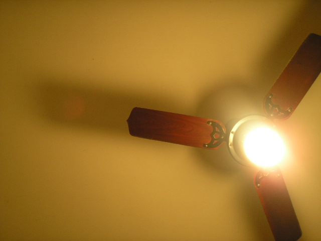 a ceiling fan with light hanging from it