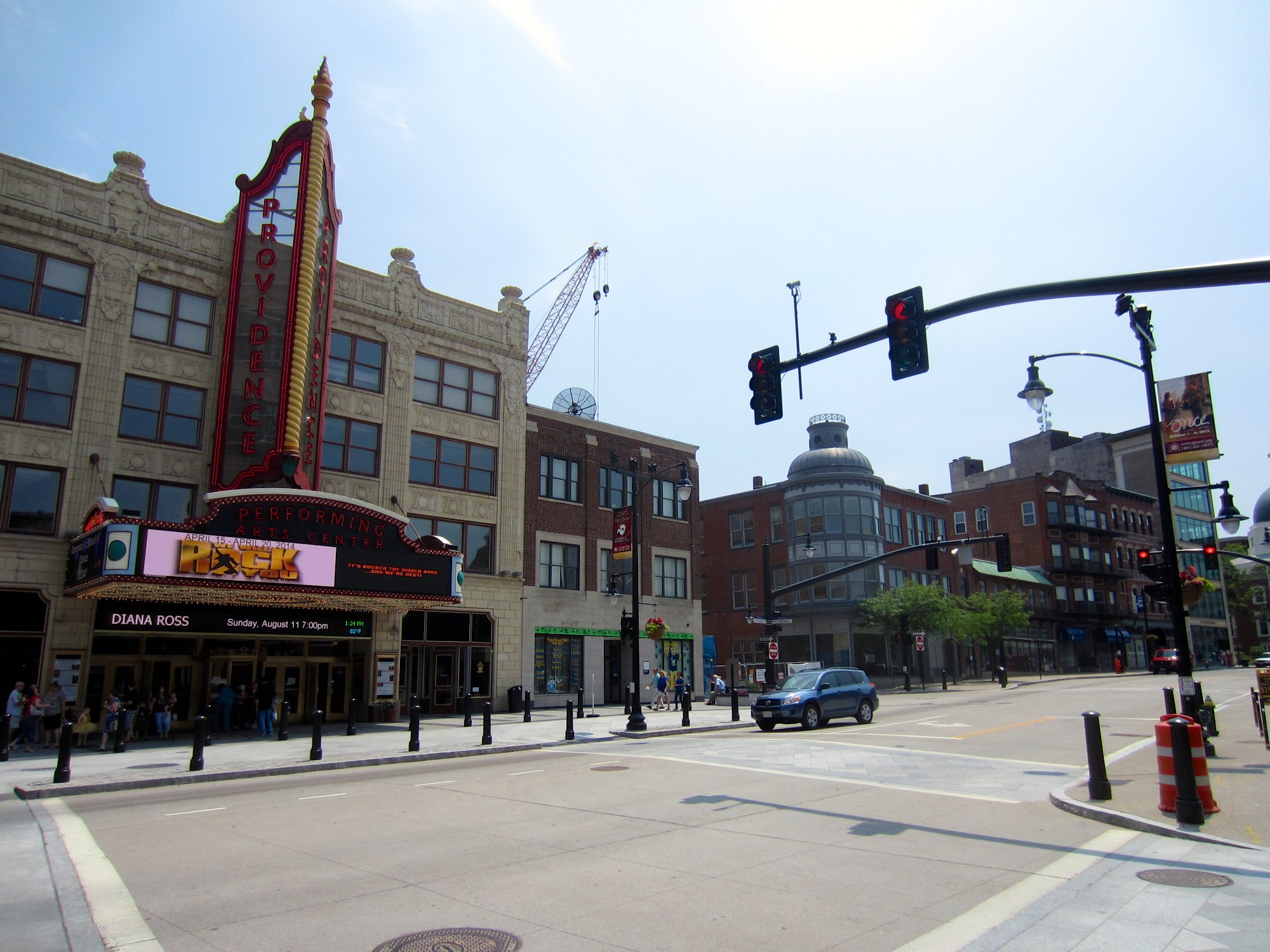 the traffic light is directing motorists towards the theater