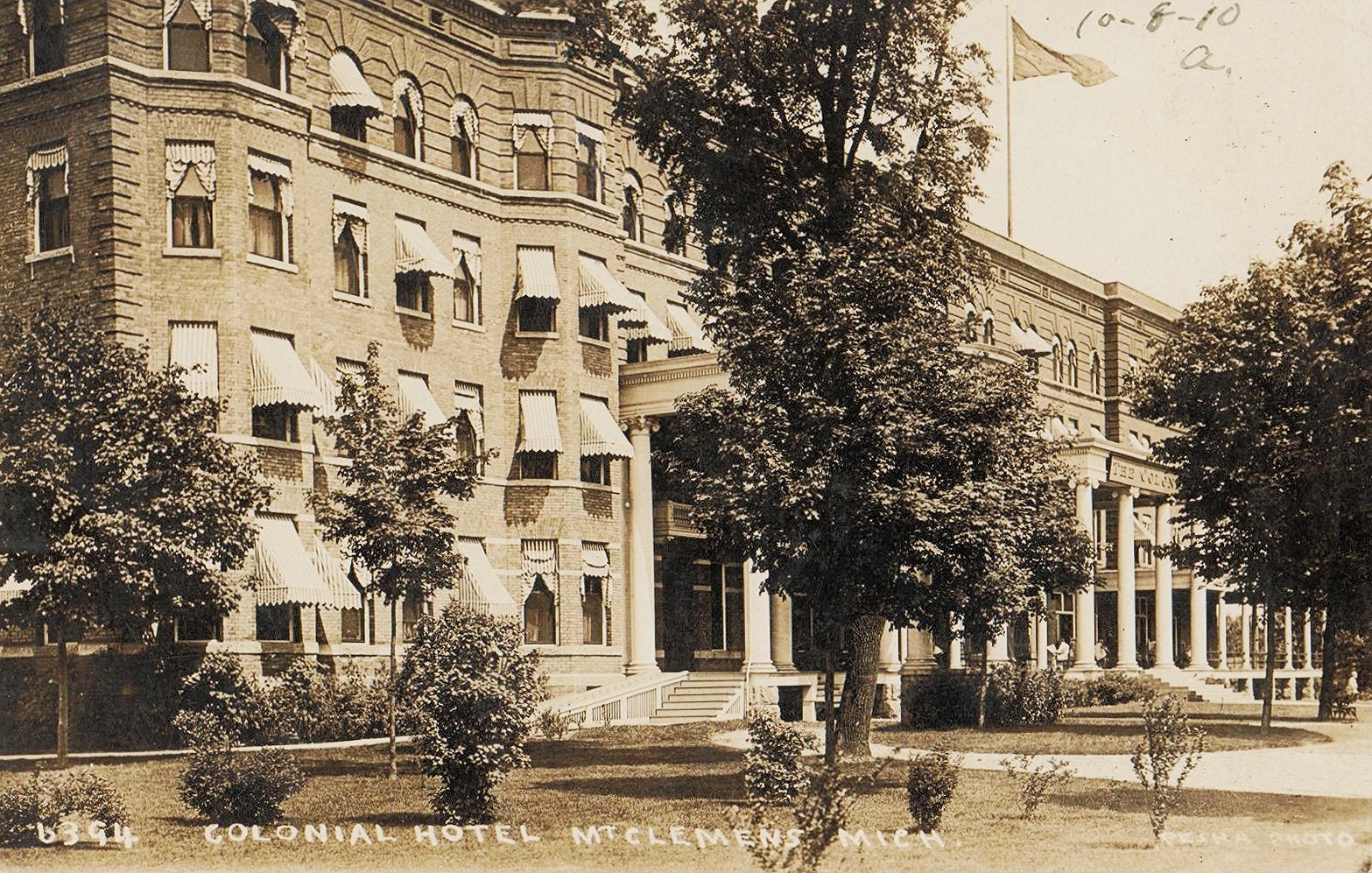 an old po shows two buildings with balconies