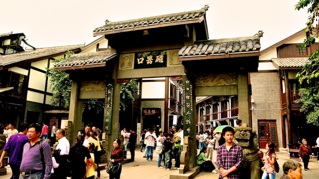 a man standing in front of a building with an elaborate entrance