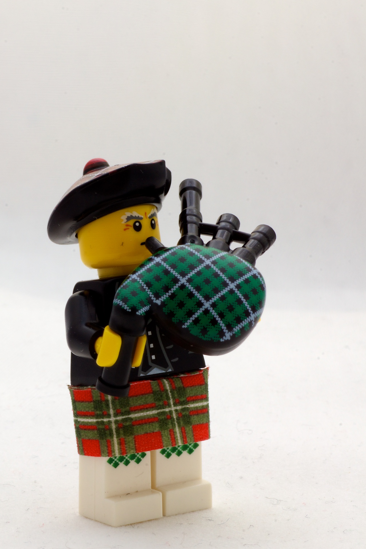 a lego toy has a bagpipe and an officer