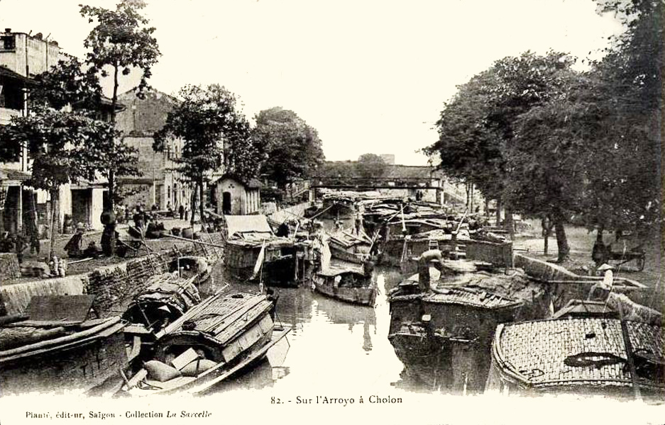 a black and white picture of a waterway with boats on it