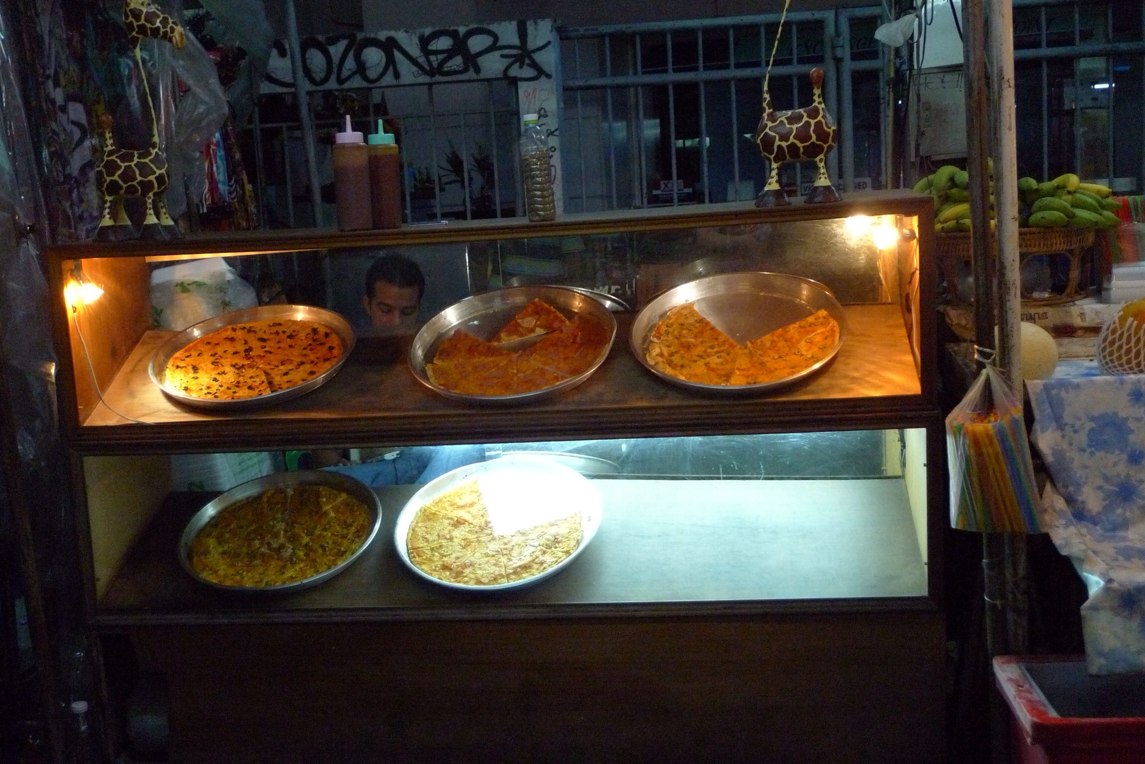 several plates are sitting on the counter next to different foods