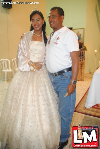 a man in jeans and a wedding dress stands with a woman