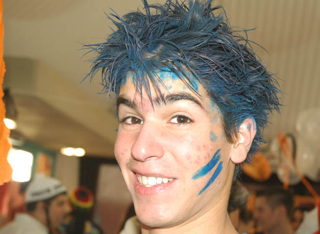 a woman with blue hair with the word wild on her face