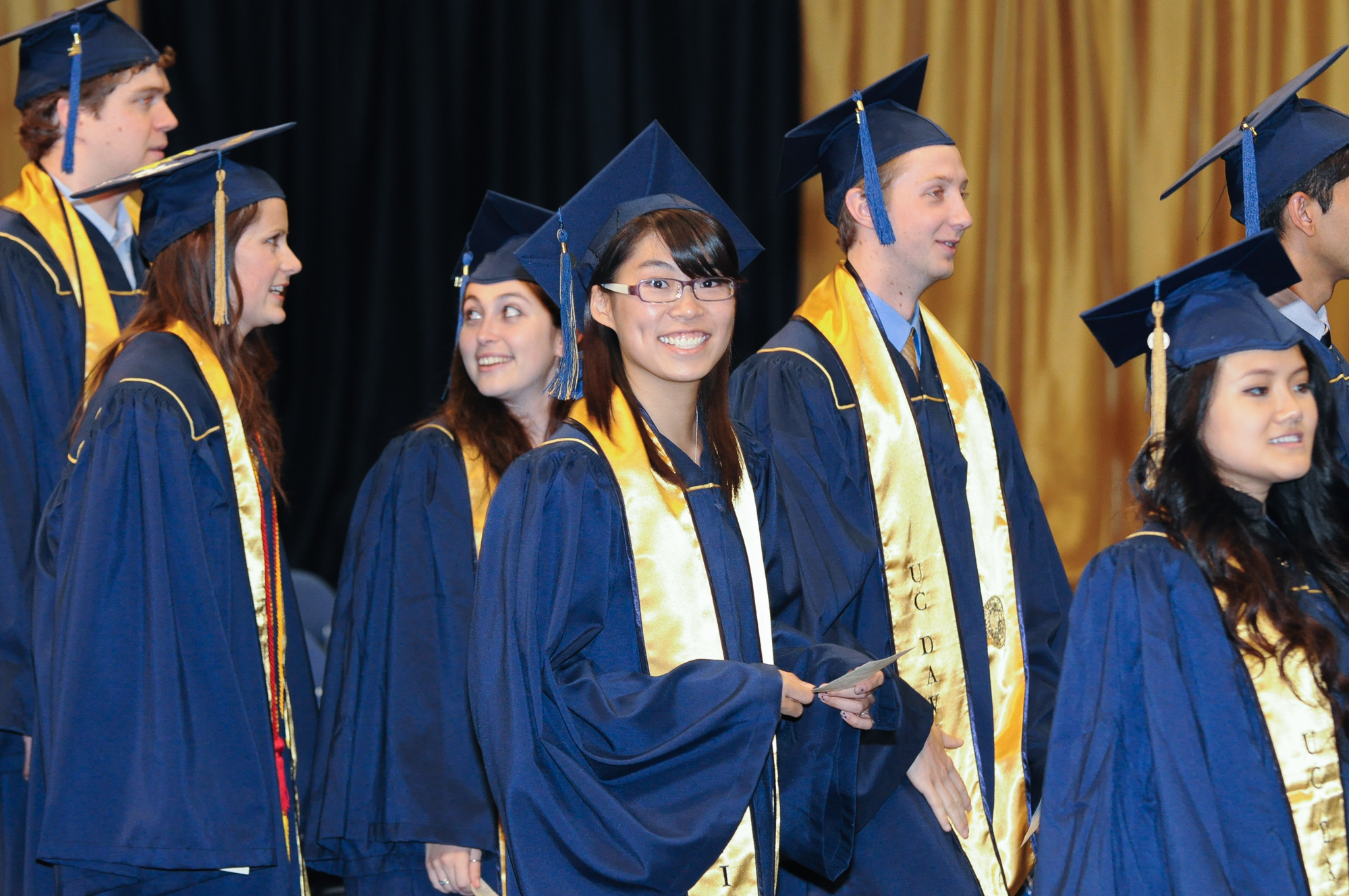 the graduates are wearing their caps and gowns