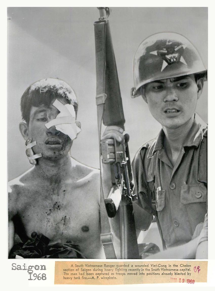 two soldier with bandages around their eyes are standing next to each other