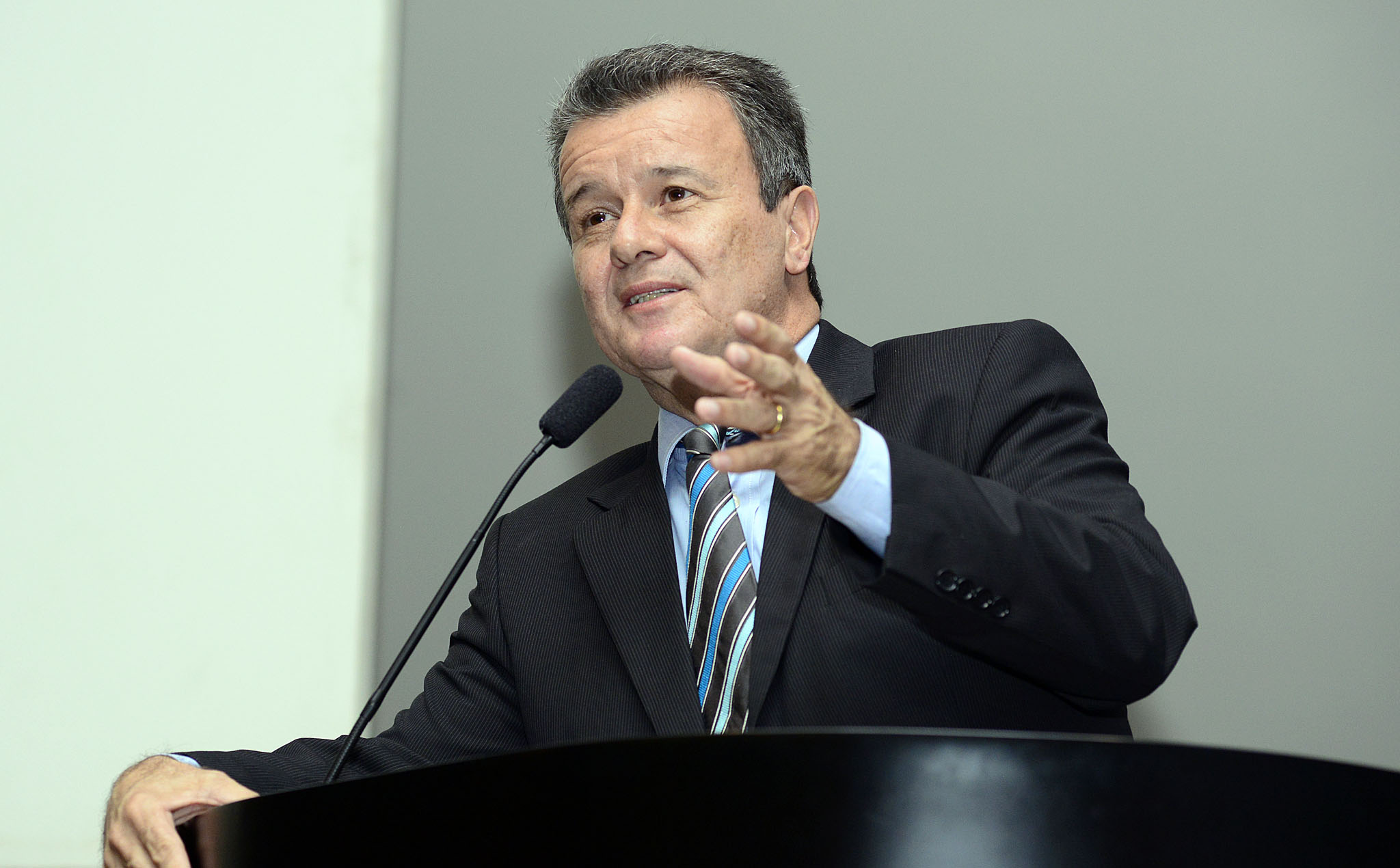a man giving a speech at a podium