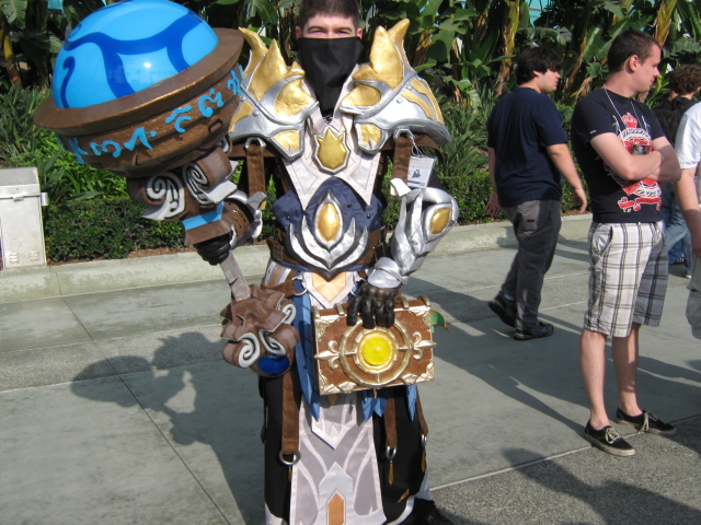 a costumed man with large ears, armor and a mask