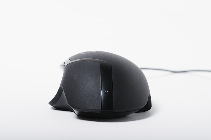 black computer mouse on white surface with wires