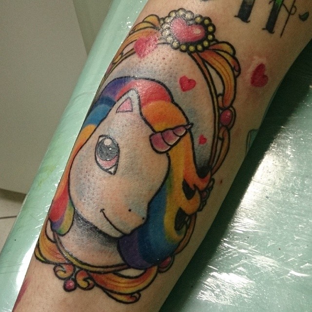 a tattoo that is done with a cute unicorn